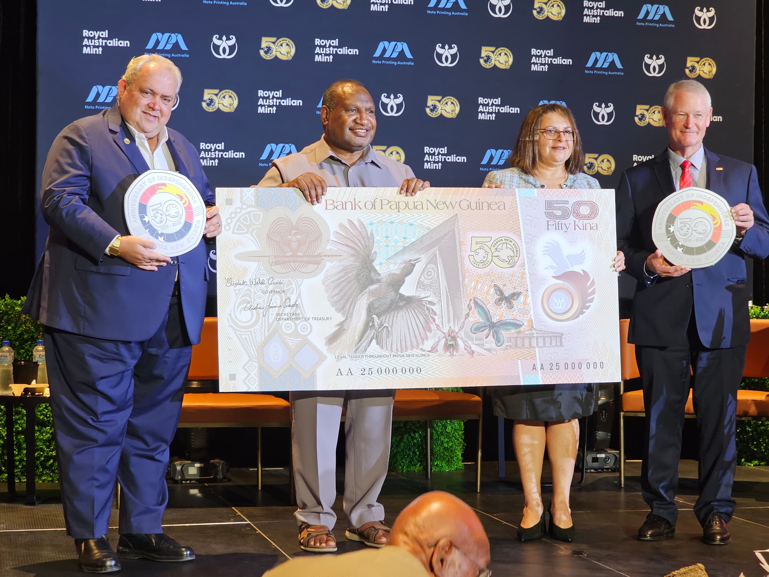 Minister Tkatchenko Officiates at the Unveiling of the New K50 note and 50 Toea coin.